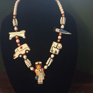 Vintage hand painted nursing themed necklace